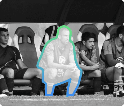 Soccer players on bench with highlighted player showing market timing analysis